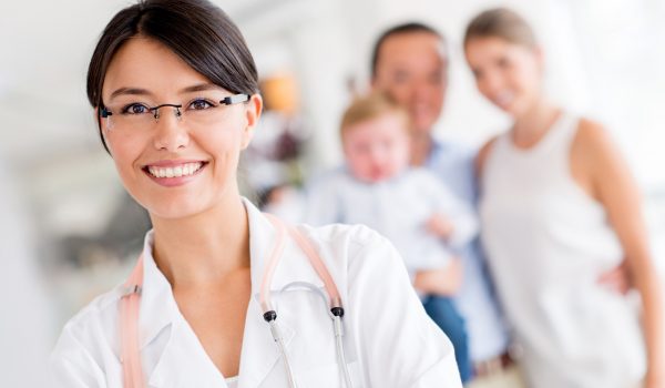 Friendly family doctor at the hospital looking happy